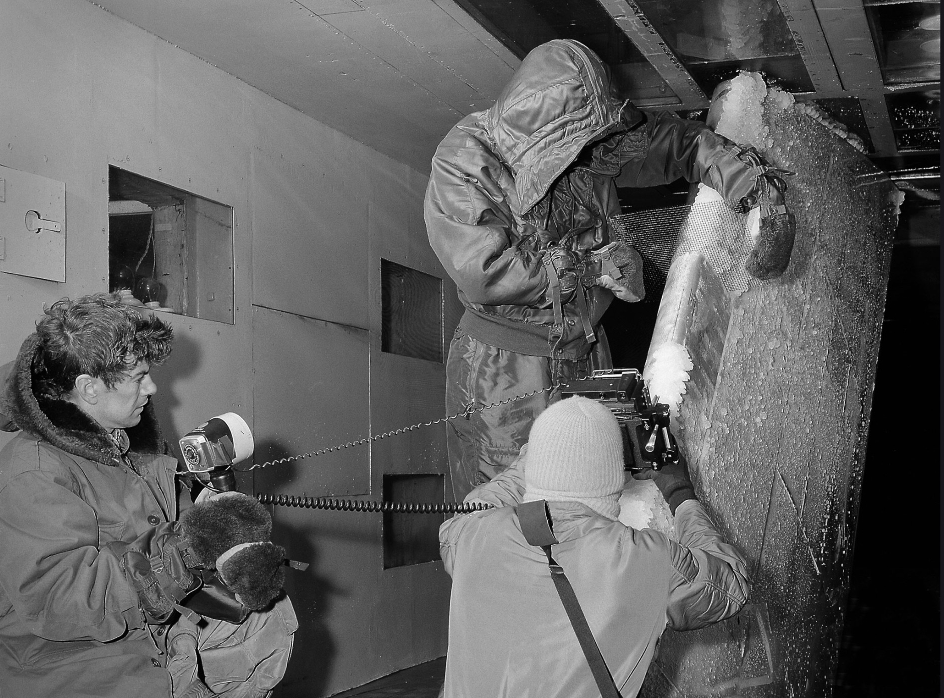Technicians set up test hardware inside the test section of the Icing Research Tunnel 